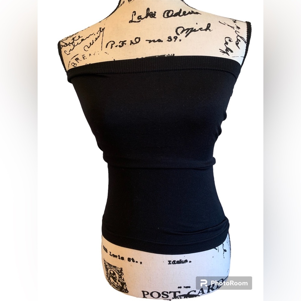 F & F straplesss black shaper, fits medium & large .